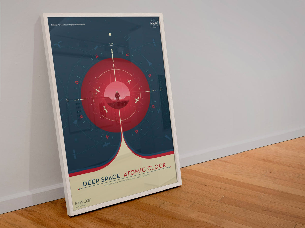 Deep Space Atomic Clock, red poster in a white frame leaning against a wall