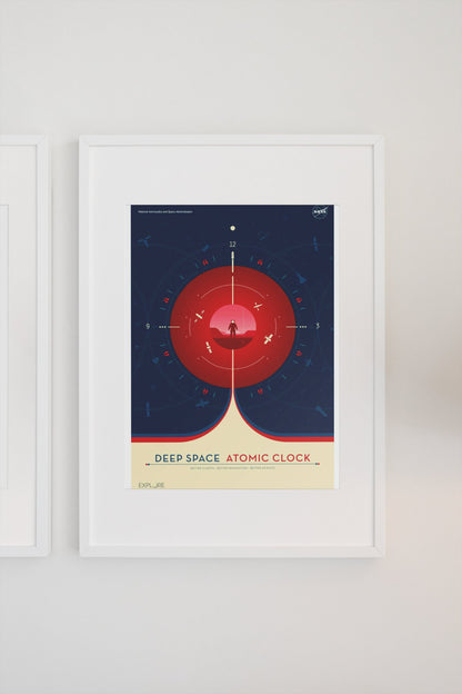 Deep Space Atomic Clock, red poster in a white frame on a light wall