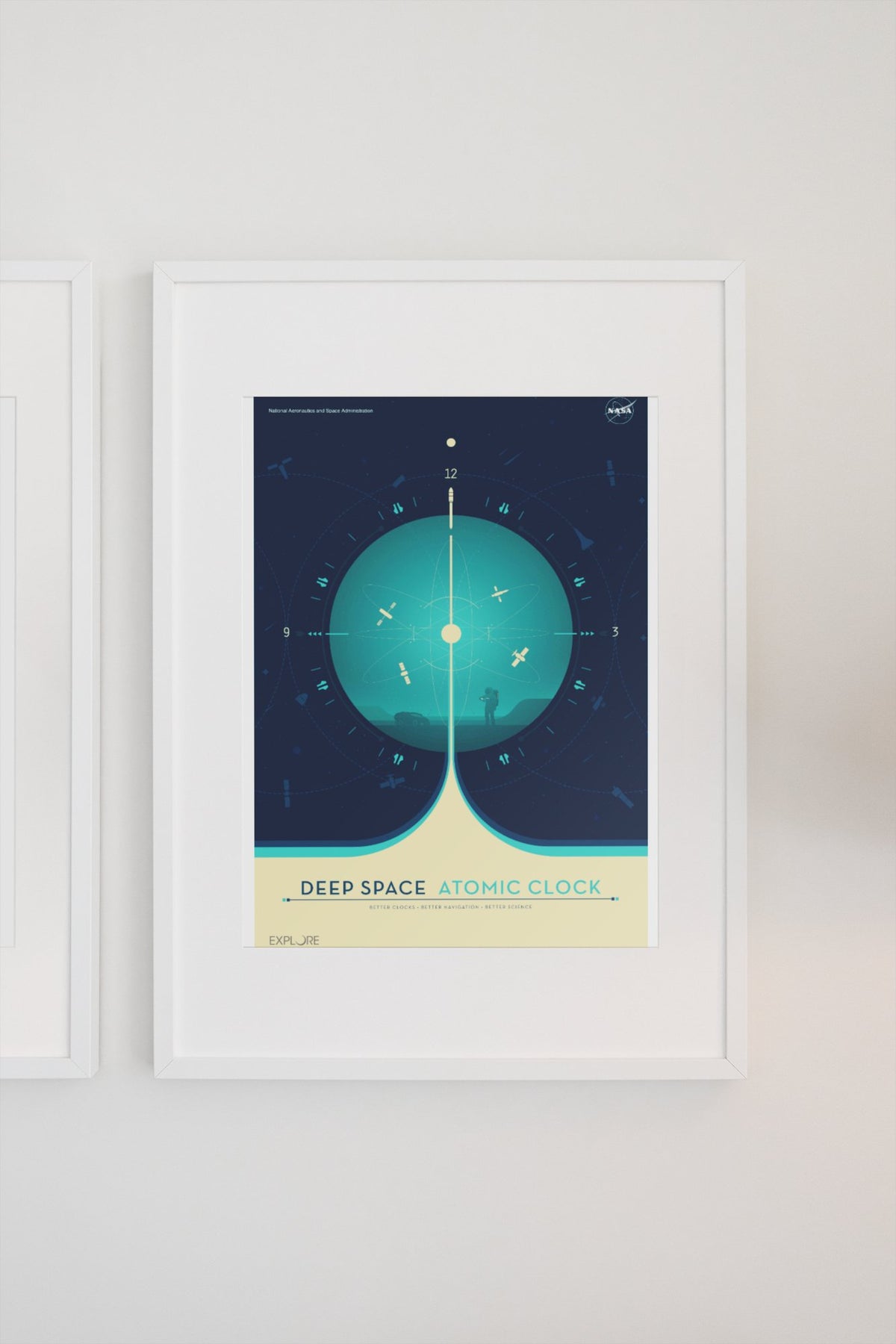 Deep Space Atomic Clock, teal poster in a white frame on a light wall