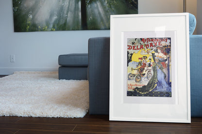 Automobiles Delahaye 1898 poster in a white frame leaning beside a blue sofa