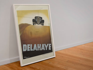 Delahaye poster in a white frame leaning against a wall