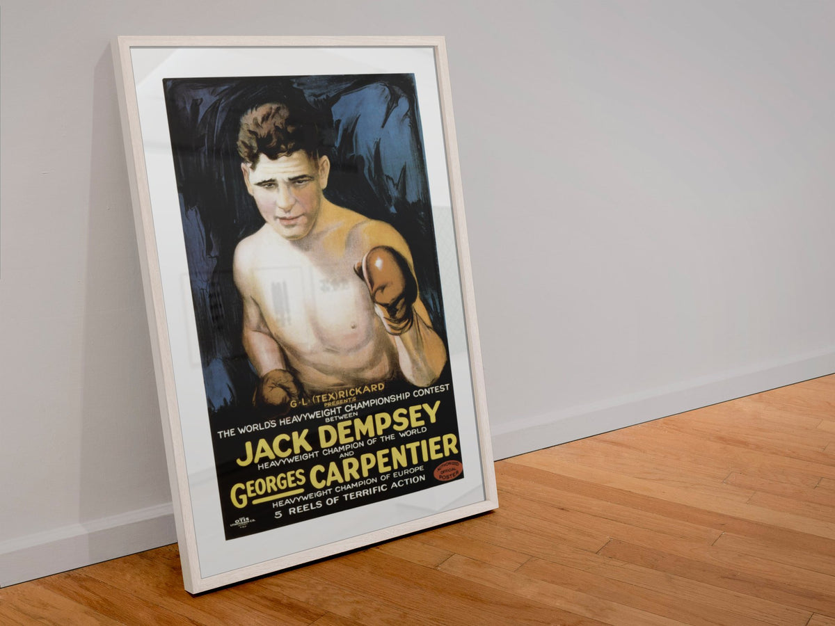 Jack Dempsey vs Georges Carpentier poster in a white frame leaning against a wall