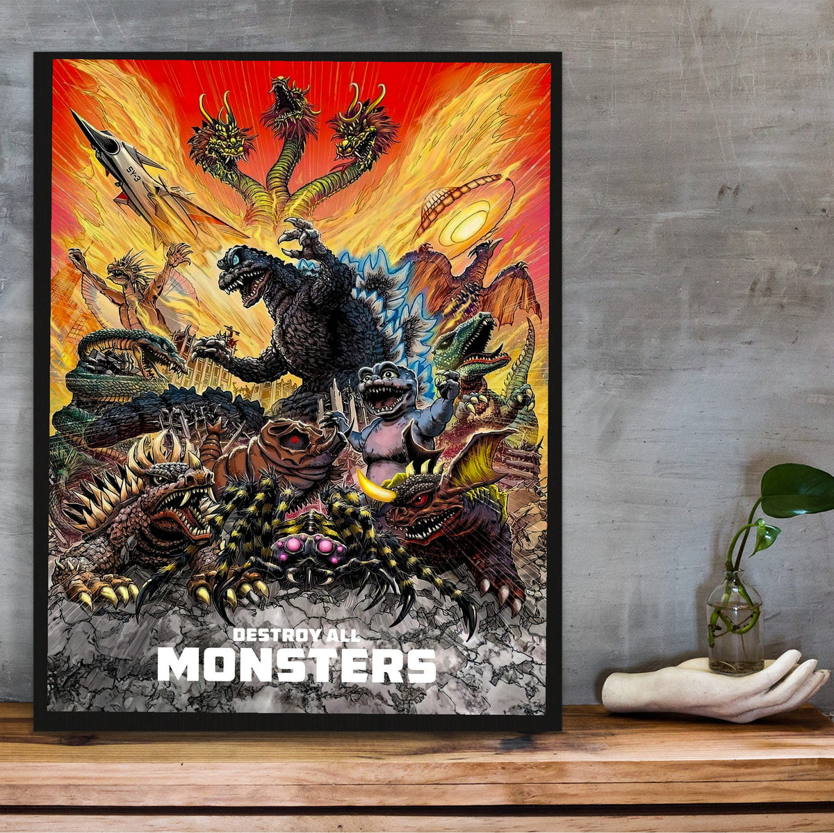 Destroy All Monsters (1968) Movie Illustrated Art poster in a black frame on a wooden shelf against concrete