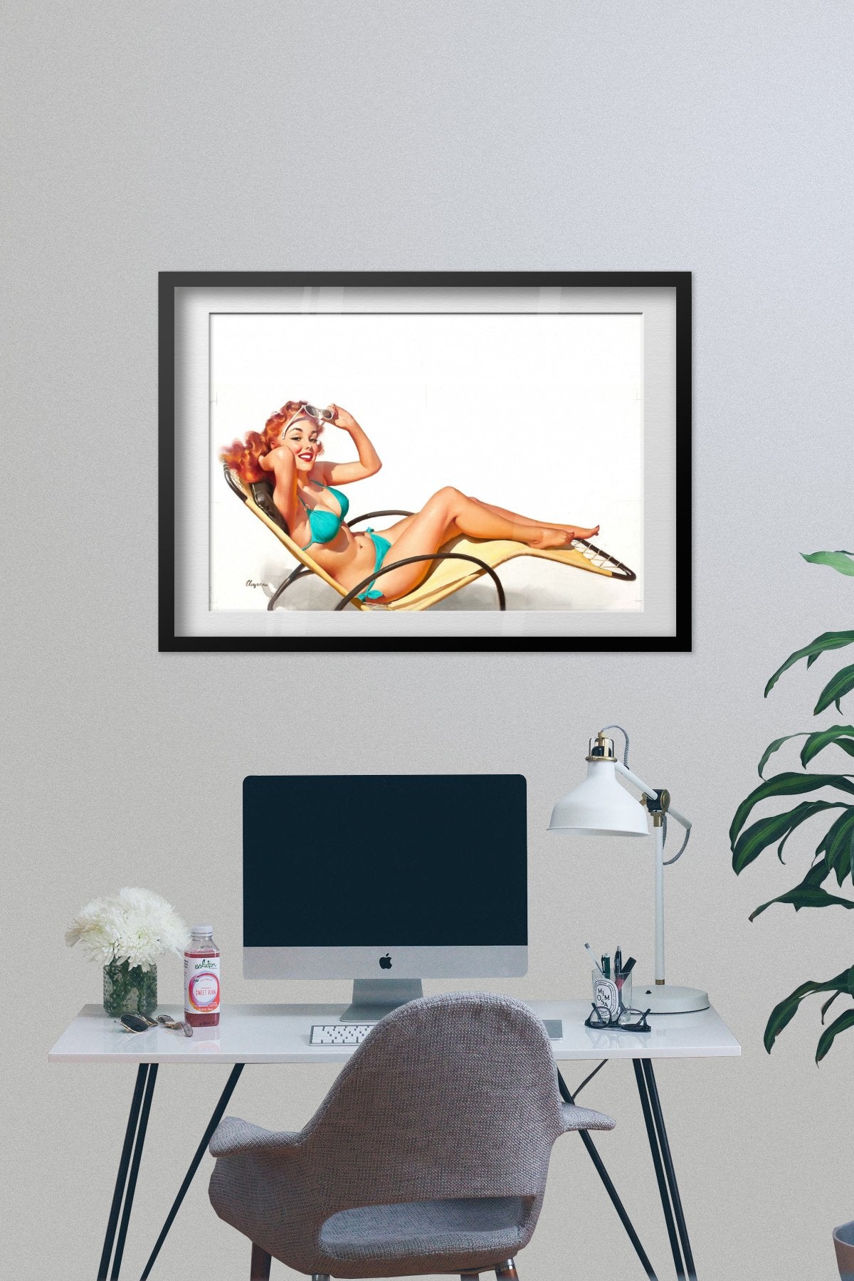 Did You Say Something? by Gil Elvgren, pin-up poster — framed on desk