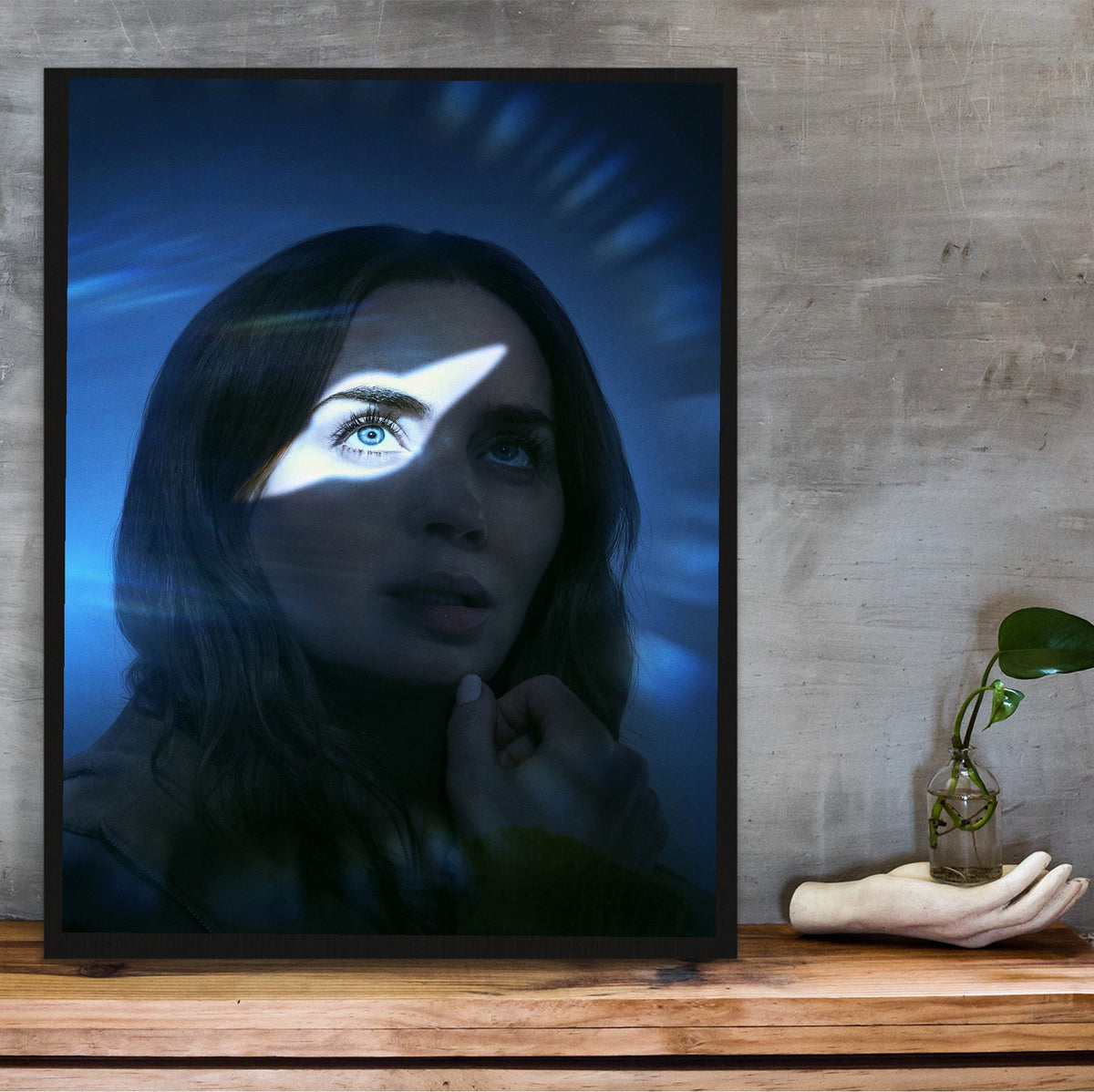 Disclosure Day (2026) Movie Key Art poster in a black frame on a wooden shelf against concrete