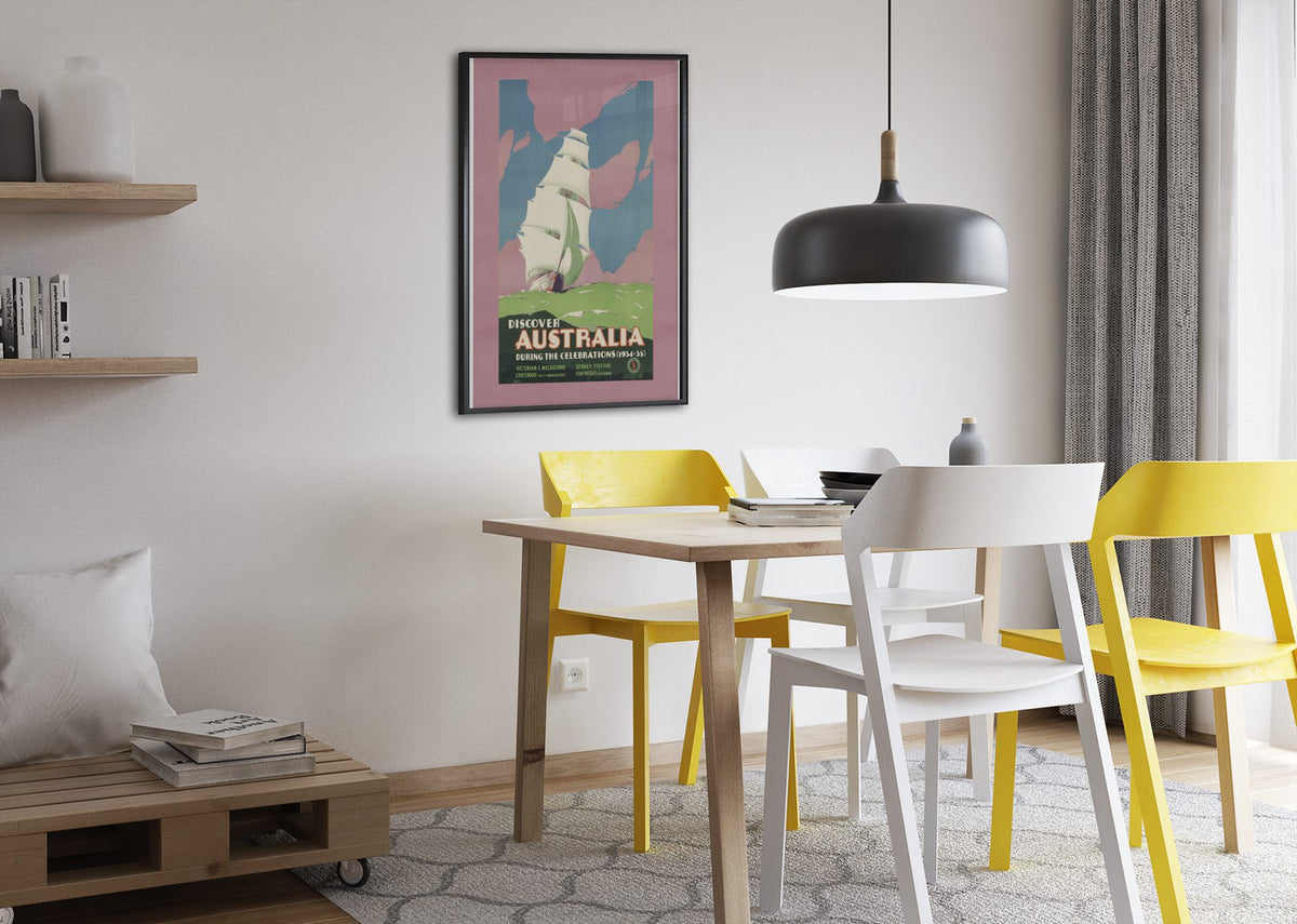 Discover Australia 1934 poster framed above a dining table