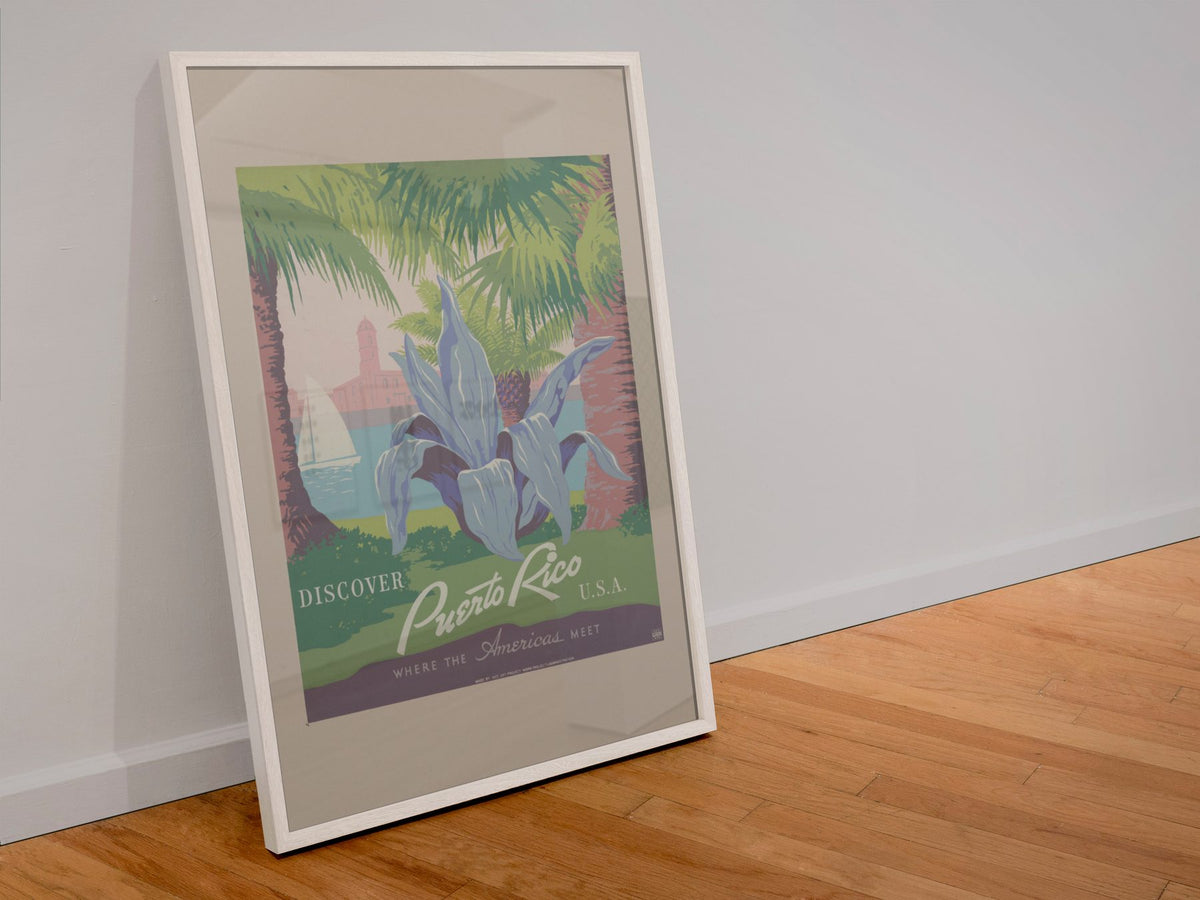 Discover Puerto Rico WPA poster in a white frame leaning against a wall