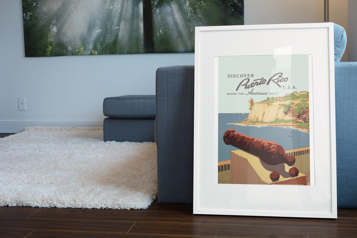 Discover Puerto Rico poster leaning beside a blue sofa