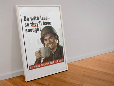 Do With Less So Theyll Have Enough poster in a white frame leaning against a wall
