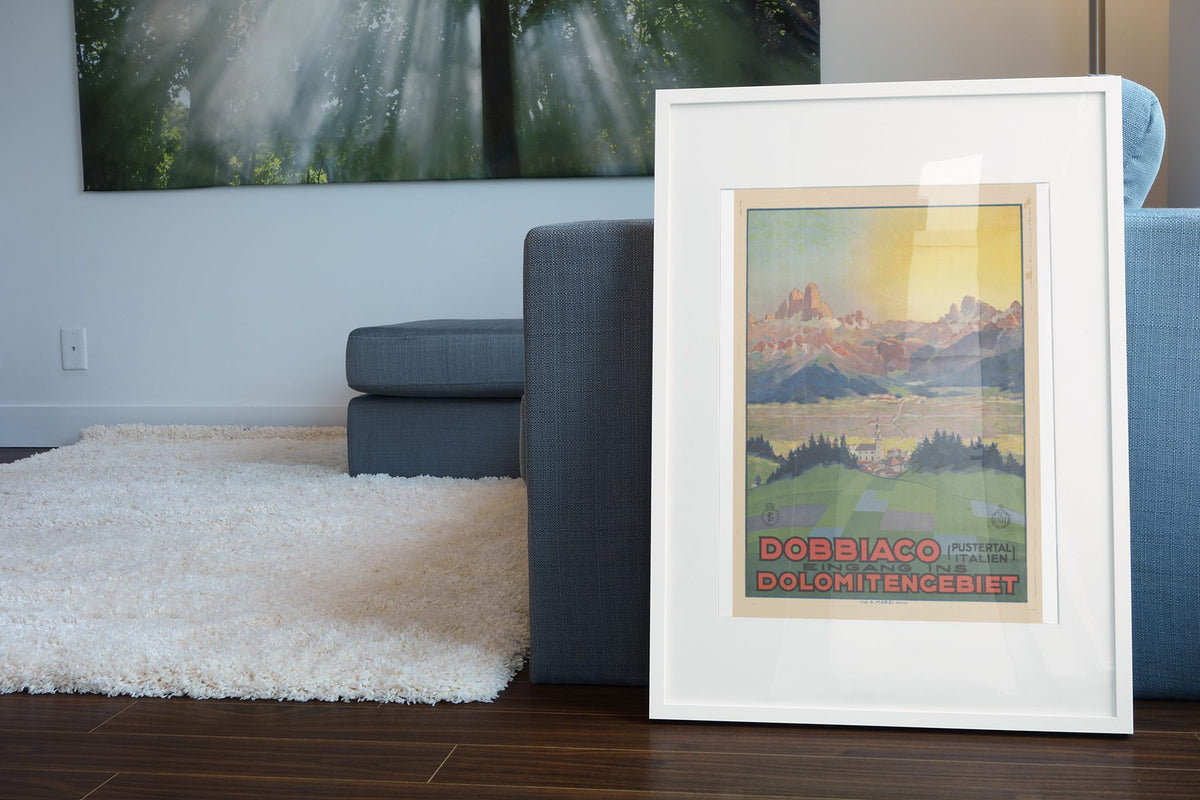 Dobbiaco — Dolomites poster leaning beside a blue sofa