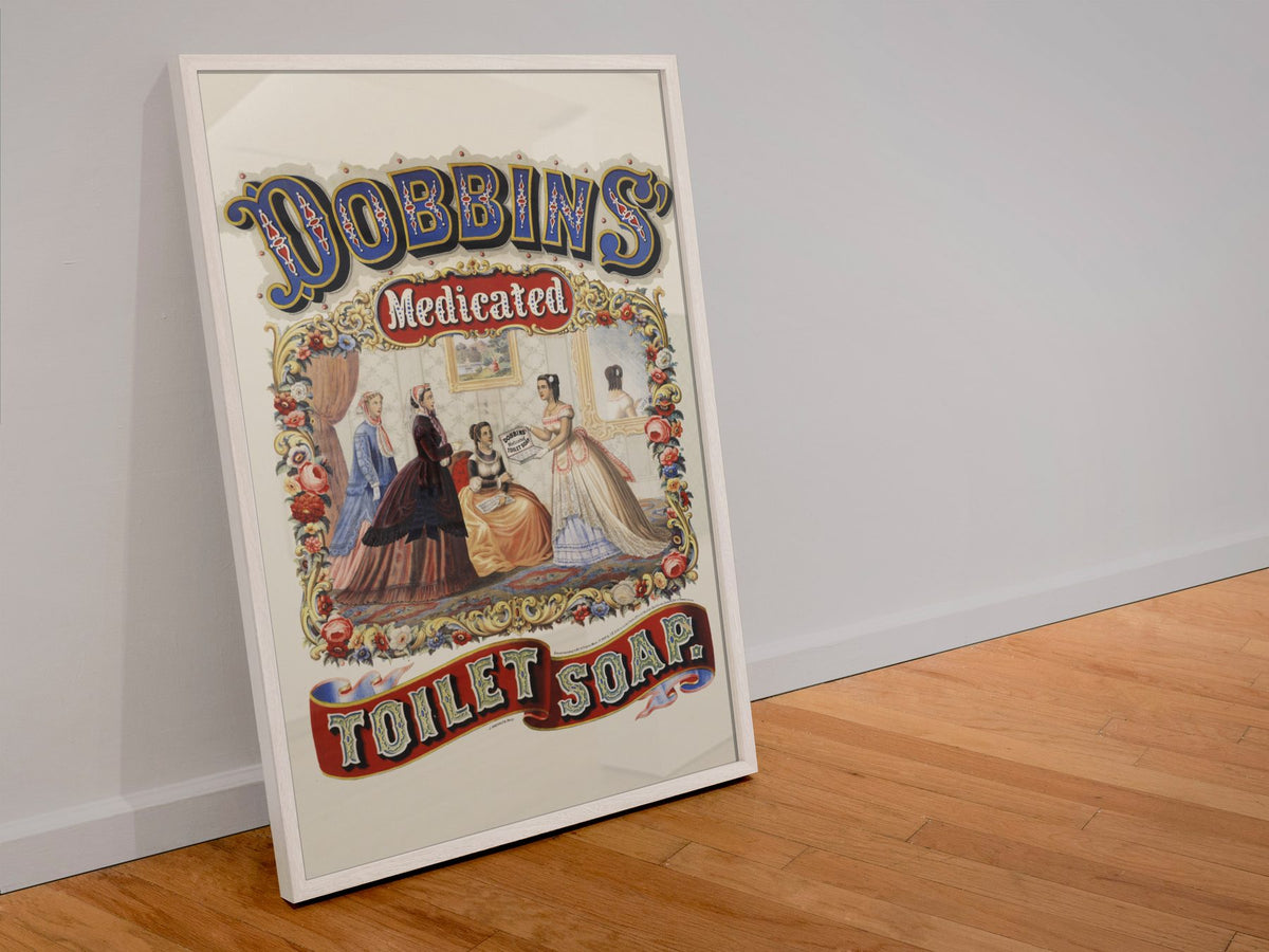 Dobbins Medicated Toilet Soap poster in a white frame leaning against a wall