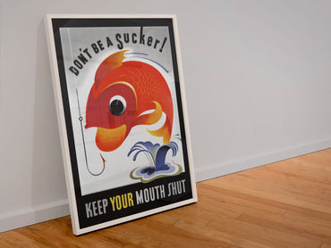 Dont Be a Sucker Keep Your Mouth Shut poster in a white frame leaning against a wall