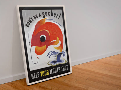 Dont Be a Sucker Keep Your Mouth Shut poster in a white frame leaning against a wall