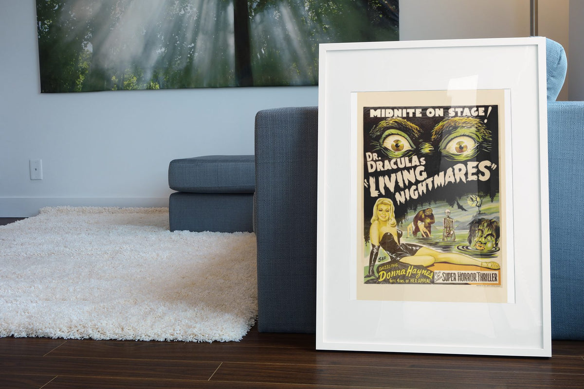 Dr Draculas Living Nightmares poster leaning beside a blue sofa