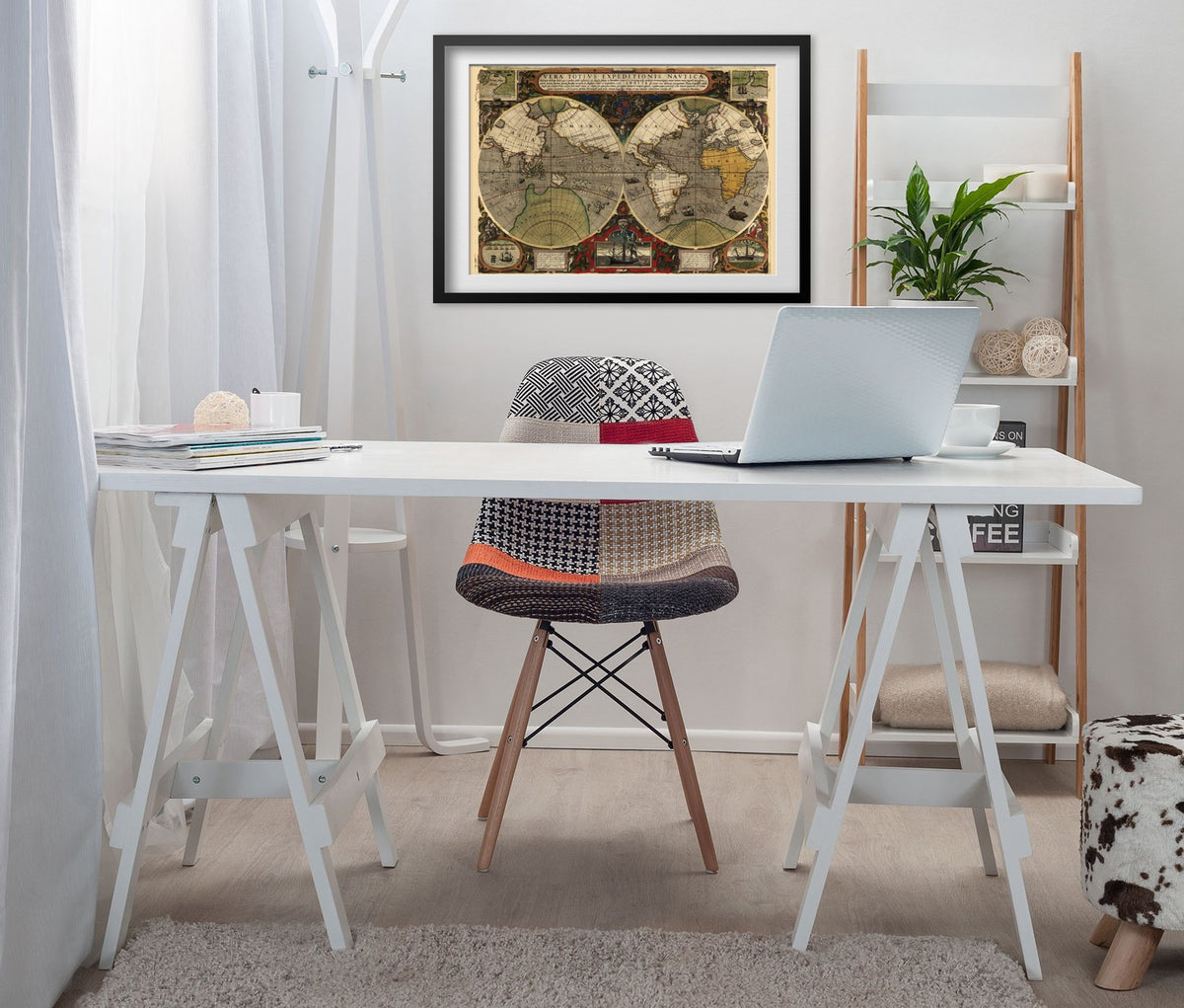 Drake Voyage Around the World 1590 framed above a white desk in a home office
