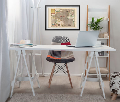 Drake West Indies Voyage 1585 framed above a white desk in a home office