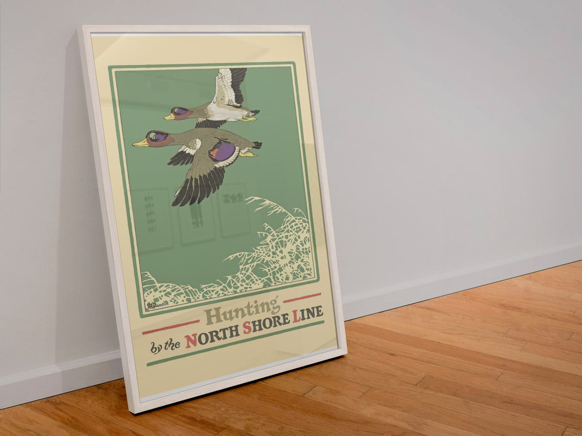Duck Hunting — North Shore Line poster in a white frame leaning against a wall