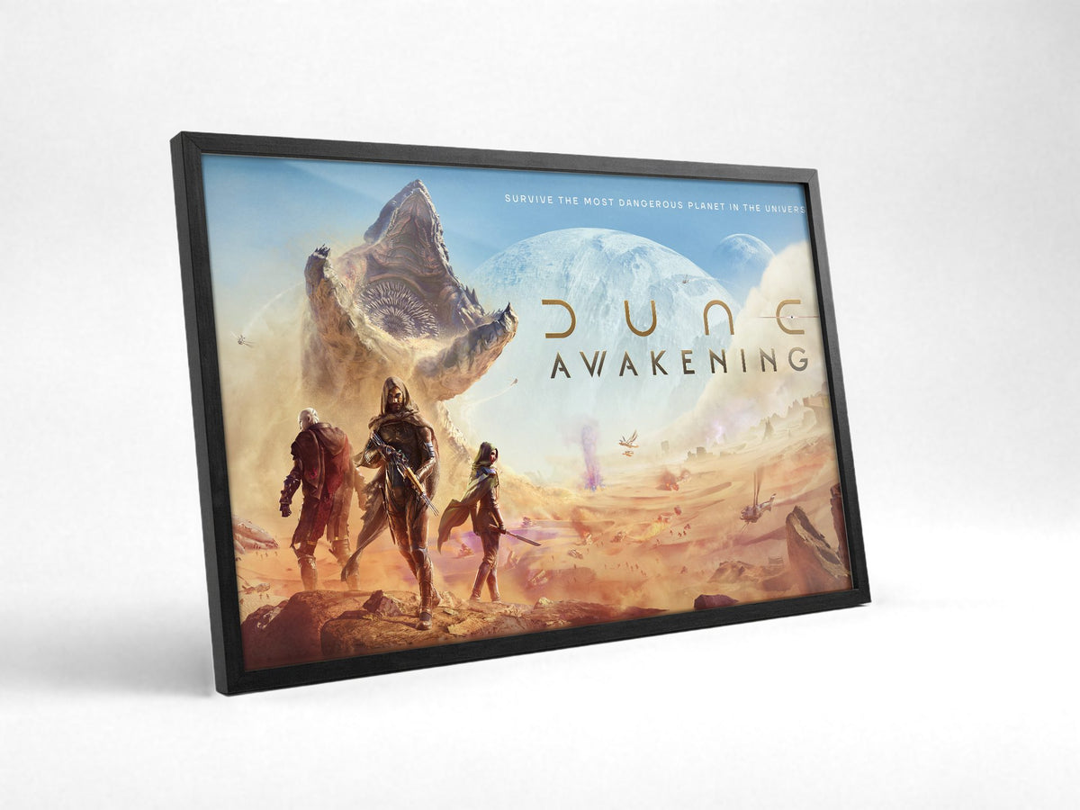 Dune: Awakening Key Art poster in a black frame with glass leaning against a wall