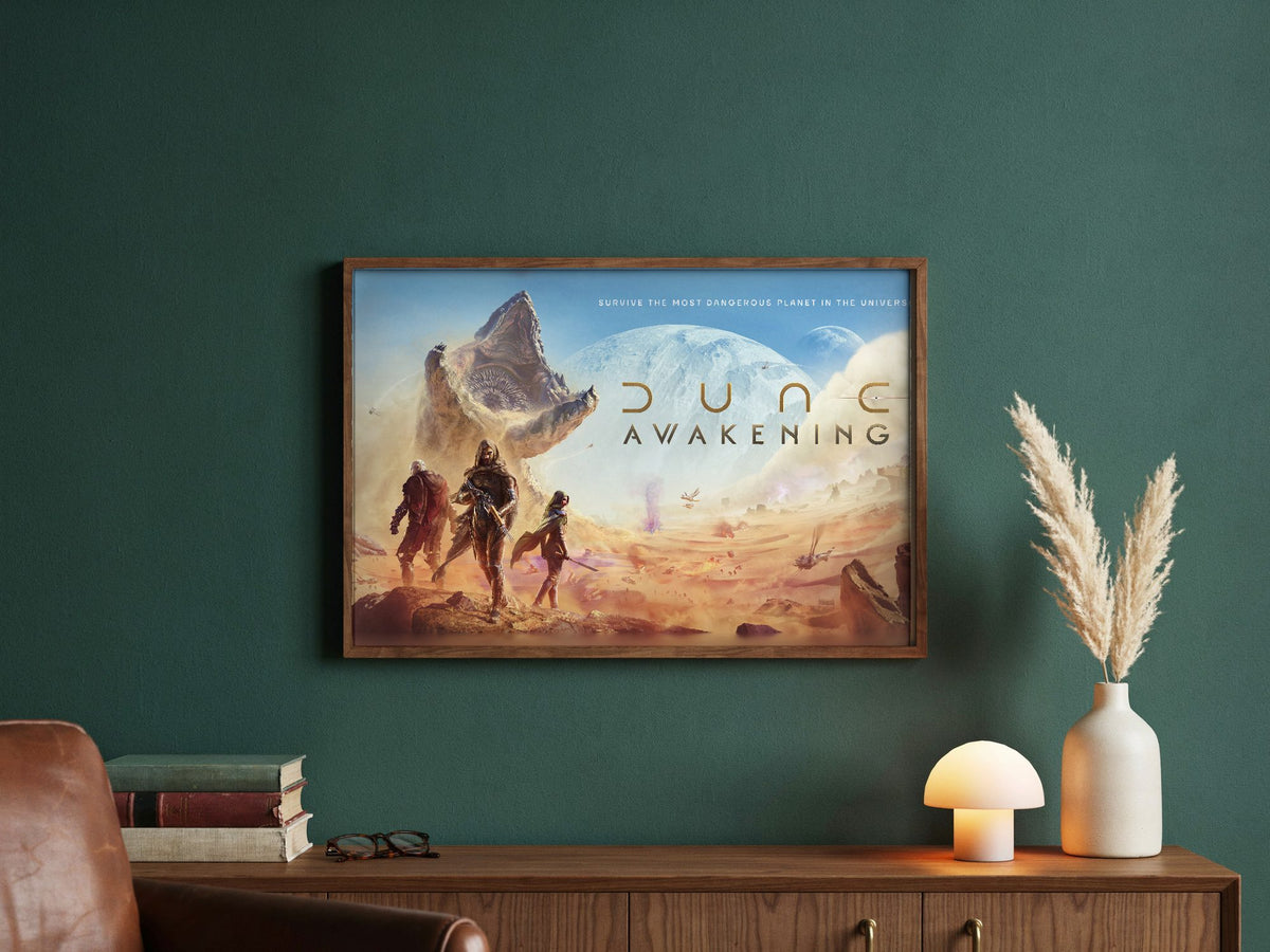 Dune: Awakening Key Art poster in a dark walnut frame in a green study