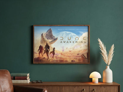 Dune: Awakening Key Art poster in a dark walnut frame in a green study
