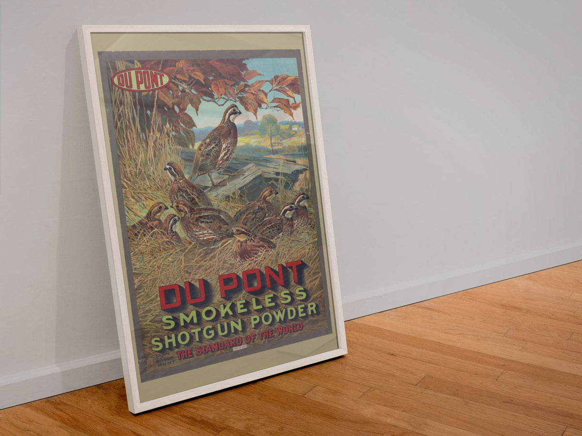 DuPont Smokeless Shotgun Powder poster in a white frame leaning against a wall