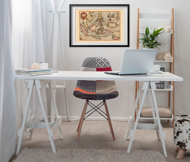 East Indies 1613 Map print framed above a white desk in a home office