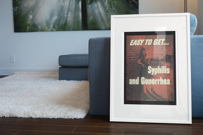 Easy to Get — Syphilis and Gonorrhea poster leaning beside a blue sofa