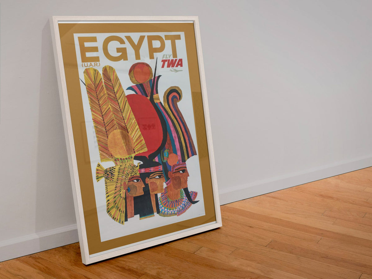 Egypt Fly TWA poster in a white frame leaning against a wall