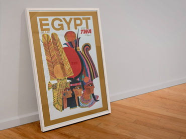 Egypt Fly TWA poster in a white frame leaning against a wall