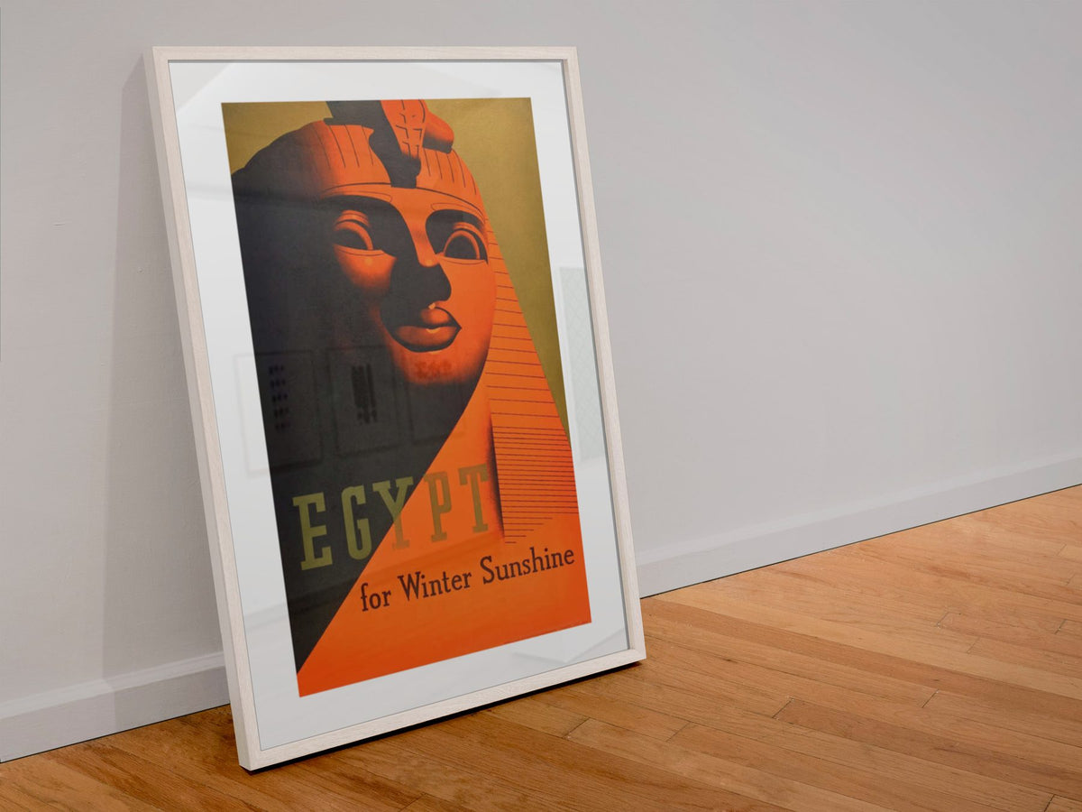Egypt for Winter Sunshine poster in a white frame leaning against a wall