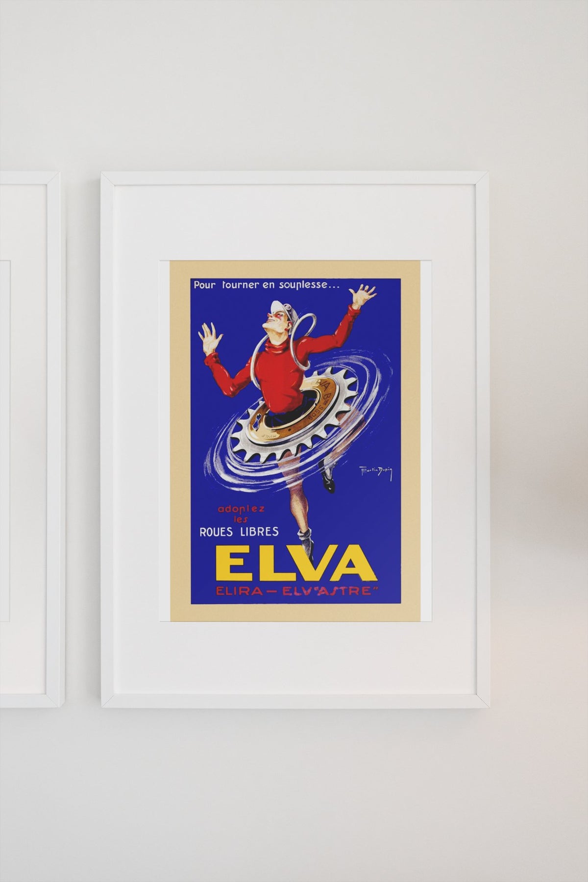 Elva Roues Libres poster on a light wall