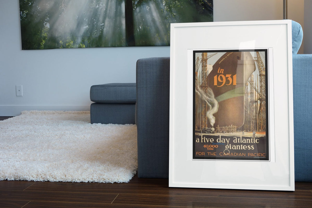 Empress of Britain — Canadian Pacific poster leaning beside a blue sofa