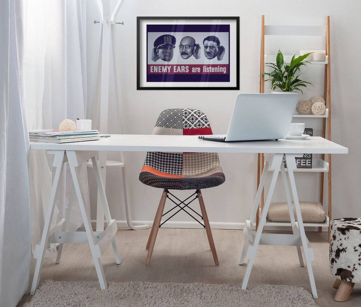 Enemy Ears Are Listening poster framed above a white desk in a home office