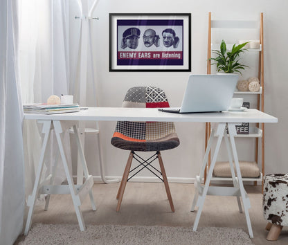 Enemy Ears Are Listening poster framed above a white desk in a home office