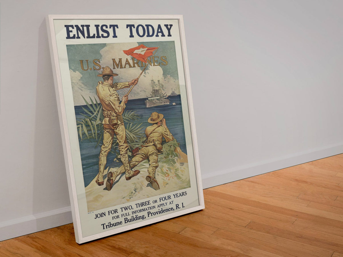 Enlist Today US Marines poster in a white frame leaning against a wall
