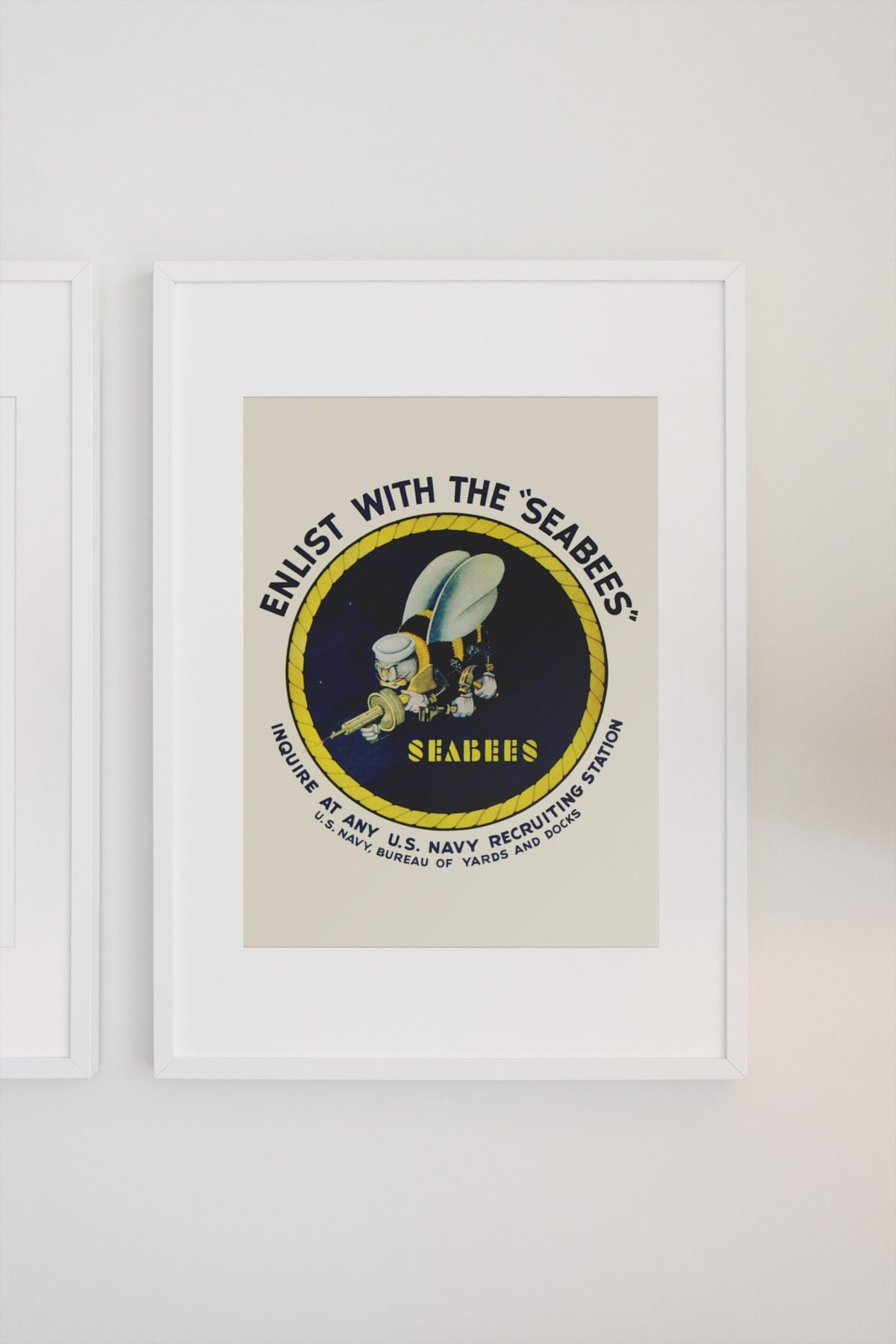 Enlist with the Seabees poster on a light wall