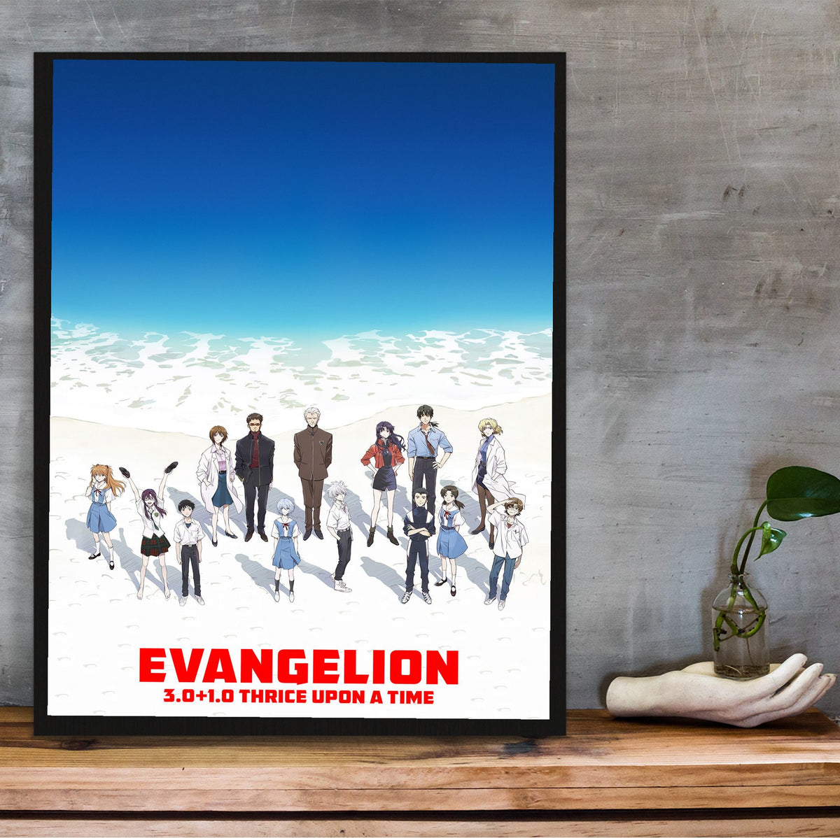 Evangelion: 3.0+1.0 Thrice Upon a Time (2021) Movie Key Art poster in a black frame on a wooden shelf against concrete