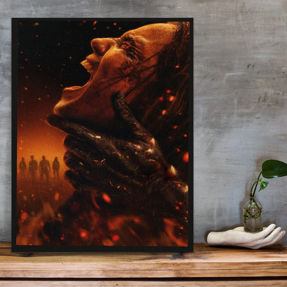 Evil Dead Burn (2026) Movie Key Art poster in a black frame on a wooden shelf against concrete
