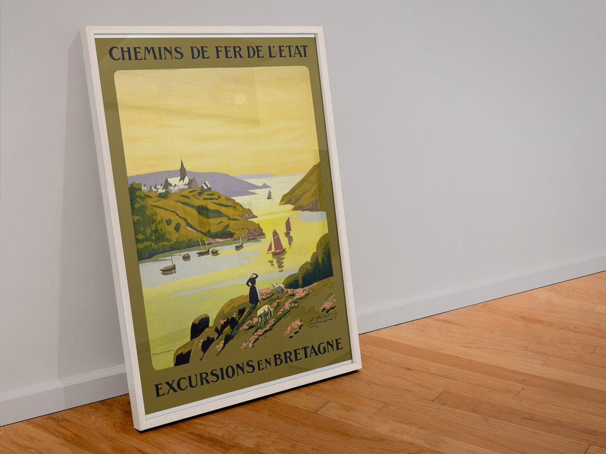 Excursions en Bretagne poster in a white frame leaning against a wall