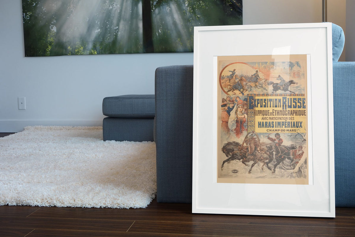 Exposition Russe poster leaning beside a blue sofa