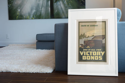 Faith in Canada Victory Bonds poster leaning beside a blue sofa
