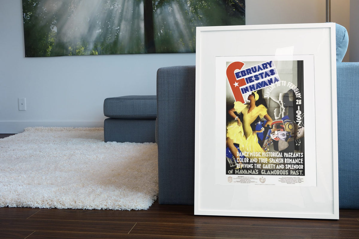 February Fiestas Havana 1937 poster leaning beside a blue sofa