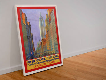 Fifth Avenue New York Travel by Train 1932 poster in a white frame leaning against a wall
