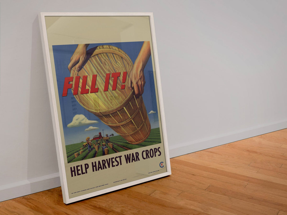 Fill It! Help Harvest War Crops poster in a white frame leaning against a wall