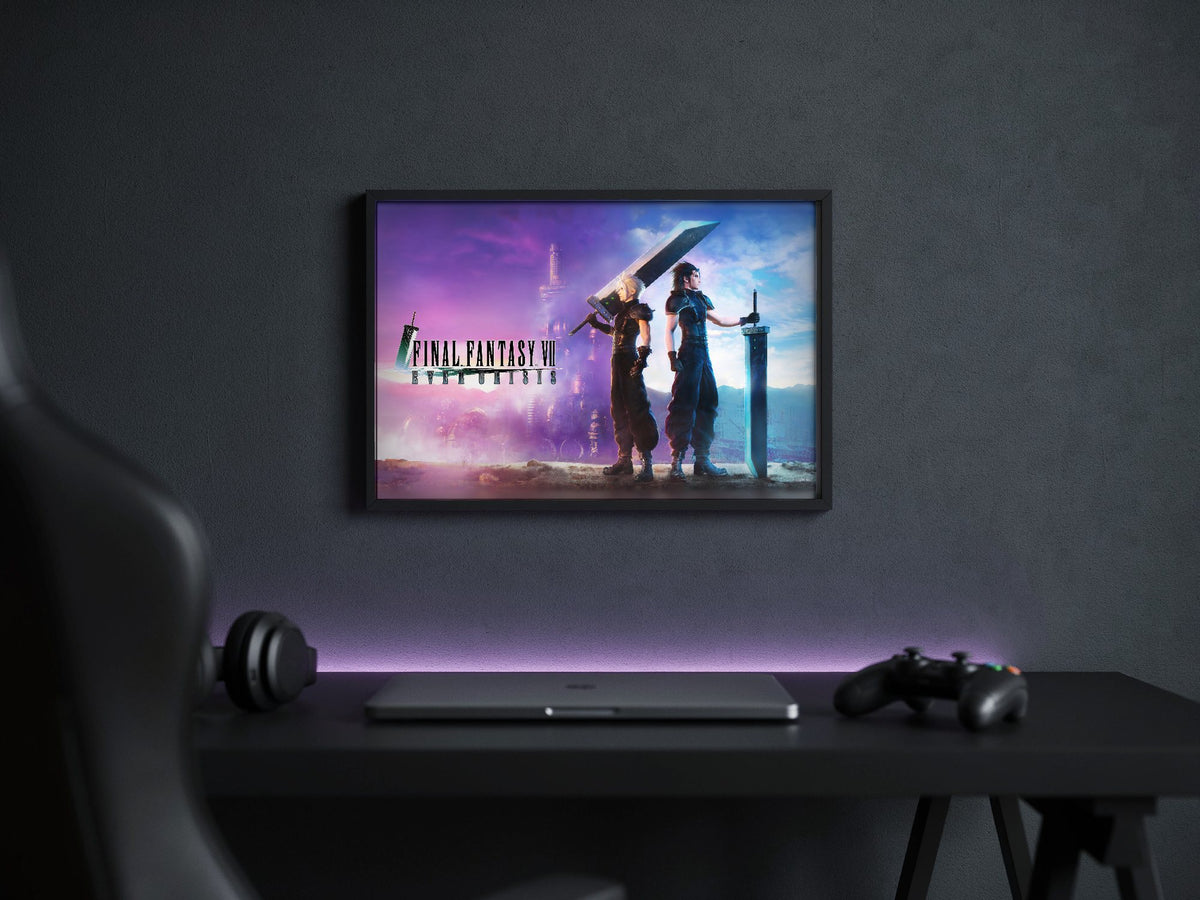 Final Fantasy VII Ever Crisis Key Art poster in a black frame above a gaming desk