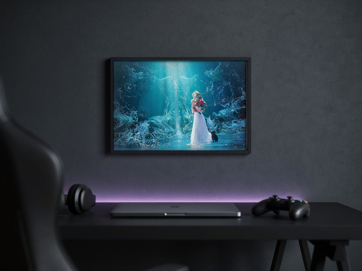 Final Fantasy VII Rebirth Aerith Key Art poster in a black frame above a gaming desk