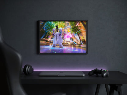 Final Fantasy VII Rebirth Cait Sith Key Art poster in a black frame above a gaming desk