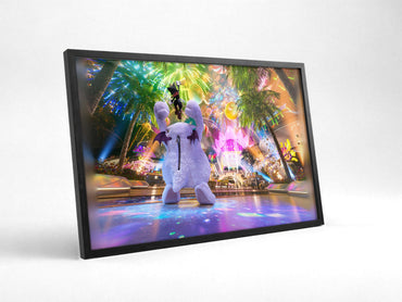 Final Fantasy VII Rebirth Cait Sith Key Art poster in a black frame with glass leaning against a wall
