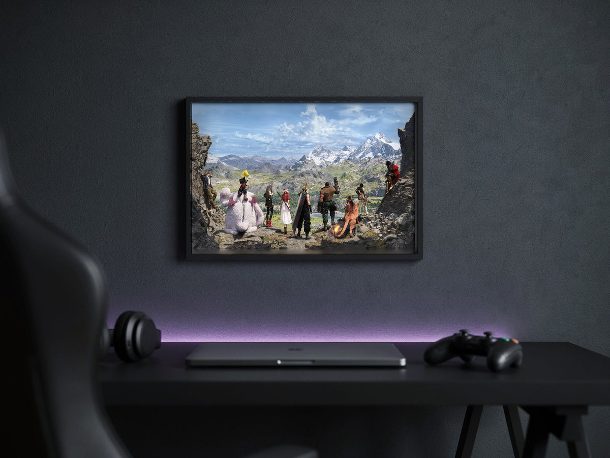 Final Fantasy VII Rebirth Full Party Key Art poster in a black frame above a gaming desk