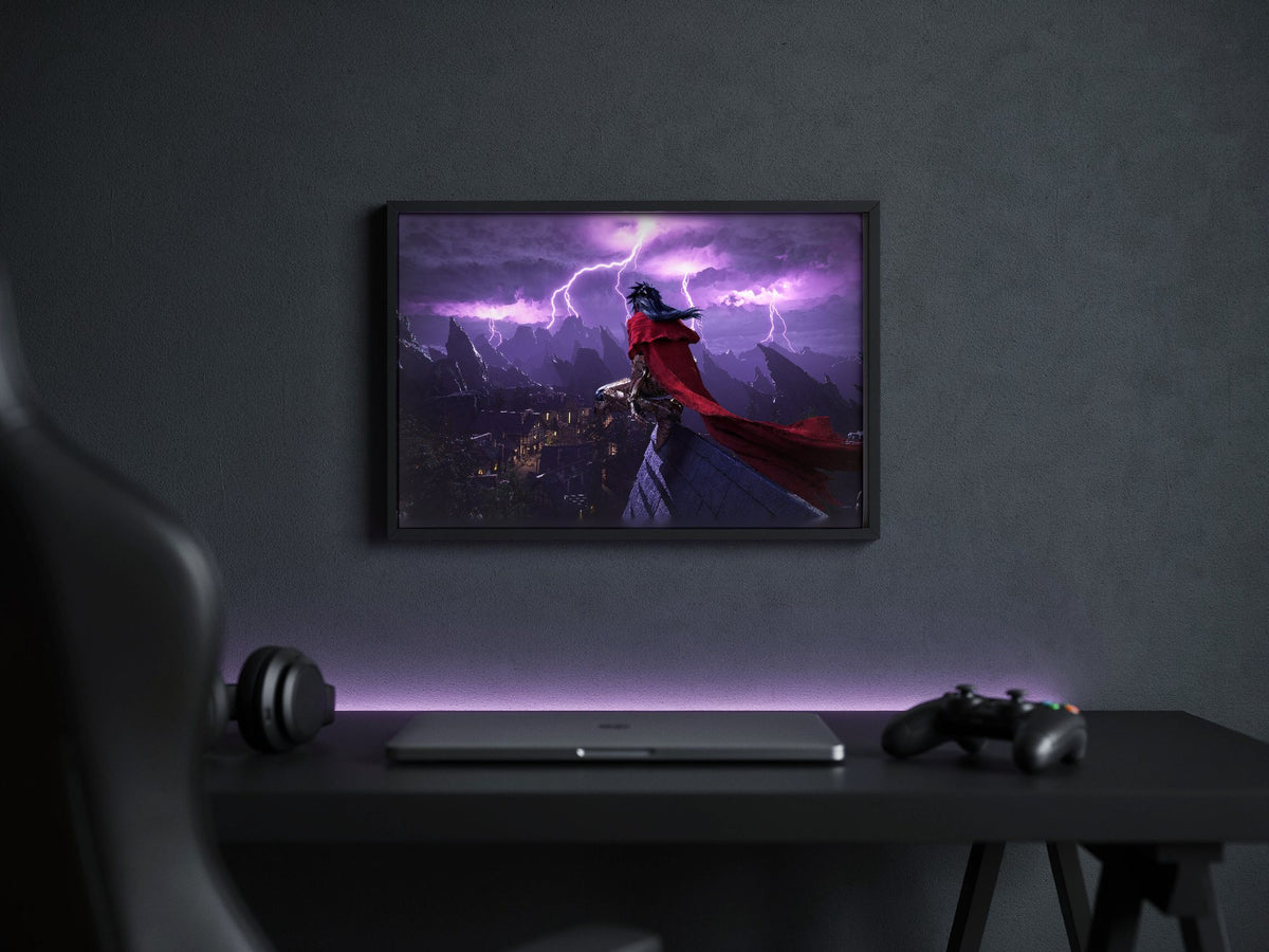 Final Fantasy VII Rebirth Vincent Key Art poster in a black frame above a gaming desk